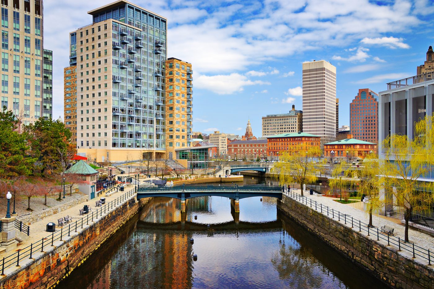 Downtown Providence buildings overlooking the river, pedestrian bridges, and walkways at Waterplace Park.
